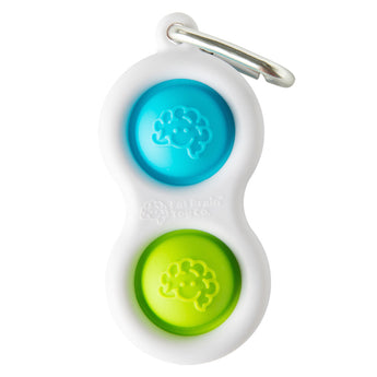 The Simpl Dimpl by Fat Brain Toy Co is a white keychain with blue and green brain-design buttons, ideal for on-the-go tactile fun.