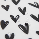 Close-up of water droplets on a Bumkins SuperBib® and Sleeved Bib 3-Piece Set: Always Hungry, XOXO, Hearts.