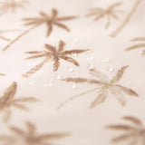 Close-up of water droplets on a Bumkins Wet Bag 2 Pack: Palm Check.