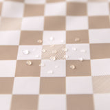 Close-up of water droplets on a Bumkins SuperBib® 3 Pack: Palms + Check.
