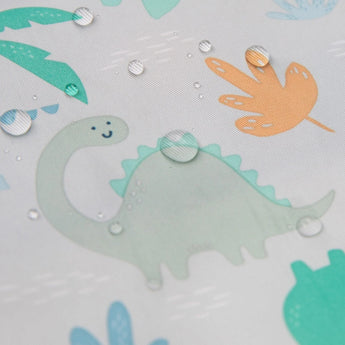 Close-up of water droplets on a Bumkins SuperBib® and Sleeved Bib 3-Piece Set: Hangry, Dinosaurs, Blue Tropics.