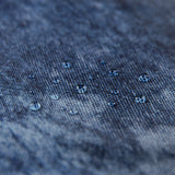 Close-up of water droplets on a Roamio by Bumkins Reusable Snack Bag, Small 2 Pack: Denim on Denim.