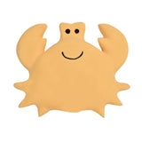 The Tikiri Toys LLC Organic Rubber Toy, Crab, features a smiling crab with big eyes and raised claws on a white background.