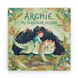 Jellycats Archie, My Dinosaur Friend Book: A child rides a green dinosaur through lush plants and flowers.