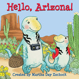 In Hello Arizona by Treasure Chest Books, two dinosaurs explore Arizona with a basket and camera amidst cacti, flowers, and lizards.