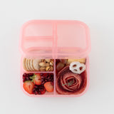 Bumkins Silicone Bento Box 3 Section: Pink Jelly holds crackers, fruit, meat, and yogurt pretzels on a white background.
