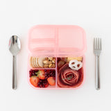 Bumkins Silicone Bento Box 3 Section: Pink Jelly filled with crackers, pistachios, fruit, salami, and yogurt pretzels on a white background.