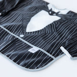 Close-up of Bumkins Sleeved Bib: Jack Skellington on a white background, showcasing the outer pocket.