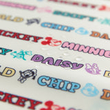 Close-up of water droplets on Bumkins Packing Cube 2 Pack: Mickey & Friends Varsity.