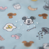 Close-up of water droplets on a Bumkins On-The-Go Mealtime 5-Piece Set: Mickey + Minnie Mouse Sunny Side Up Pink.