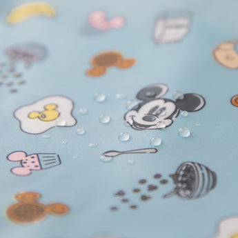 Close-up of water droplets on Bumkins Wet/Dry Clutch: Mickey + Minnie Sunny Side Up.