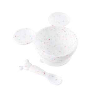 Bumkins Silicone First Feeding Set: Mickey Mouse Vanilla Sprinkle includes a confetti Mickey Mouse-shaped silicone bowl and matching spoon.
