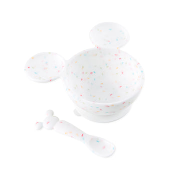 Bumkins Silicone First Feeding Set: Mickey Mouse Vanilla Sprinkle includes a confetti Mickey Mouse-shaped silicone bowl and matching spoon.
