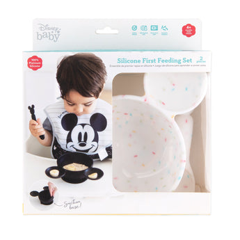 Bumkins Silicone First Feeding Set: Mickey Mouse Vanilla Sprinkle is shown in a packaging box, with a clear window partially showing the bowl.