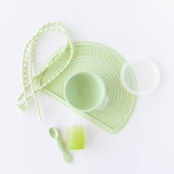Bumkins Baby-Led Weaning Deluxe 7-Piece Set: Sage is neatly arranged on a white background.