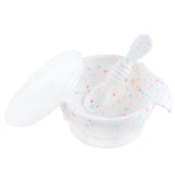 Bumkins Silicone First Feeding Set: Vanilla Sprinkle includes a white speckled bowl with secure suction base, matching spoon, and clear lid.