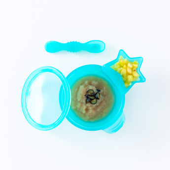 Bumkins Silicone First Feeding Set: Blue Jelly, with applesauce and berries, sits on a white background with a blue star-shaped cup of fruit.