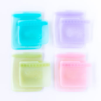 Bumkins Silicone Flat Reusable Bag 2 Pack, Lavender and three other bag sets are arranged on a white background.