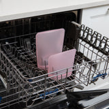Bumkins Silicone Flat Reusable Bag 2 Pack, Pink sits in the top rack of an open dishwasher.