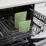 Bumkins Silicone Flat Reusable Bag 2 Pack, Sage sits in the top rack of an open dishwasher.