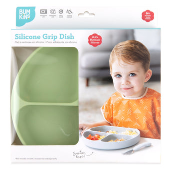 Bumkins Silicone Grip Dish: Sage in a white packaging box with a photo of a child and a clear window partially displaying the dish.
