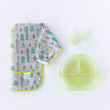 Bumkins Grip Dish Deluxe Infant 5-Piece Mealtime Set: Green Jelly sits next to a folded cactus-patterned bib on a white background.