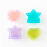 Bumkins Silicone Little Dipper Combo 2 Pack: Aqua Jelly sits with other similar silicone cups on a white background.
