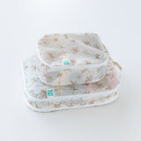 An angled side view of Bumkins Packing Cube 2 Pack: Palm Daze, stacked on a white background.