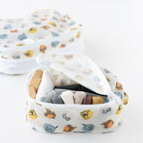 Bumkins Packing Cube 2 Pack: Winnie + Friends is displayed on a white background; one cube is open with neatly folded clothes inside.