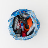 Aerial view of Bumkins Packable Tote Bag: Mickey & Friends Forever holding a soccer ball, shoes, and bottle on white background.