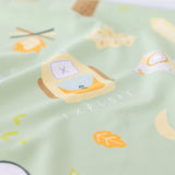 Close-up of Bumkins Reversible Roll & Go Blanket, Happy Camper: camping-themed illustrations on light green with lantern and EXPLORE motif.