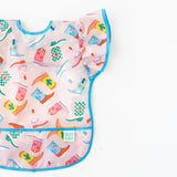 Bumkins Ruffle Apron Bib: Boots lays flat on a white background.