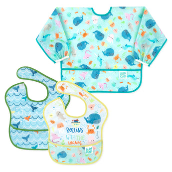 Bumkins SuperBib® and Sleeved Bib 3-Piece Set: Rolling With The Waves, Whale Tail, Ocean Life—3 blue ocean-themed waterproof bibs.