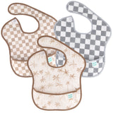 Bumkins SuperBib® 3 Pack: Palms + Check includes three waterproof bibs—one tan checkered, one gray checkered, and one with a palm tree design.