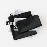 Roamio by Bumkins Snack Bag 4 Pack: Rich & Boujee lays stacked on a white background.