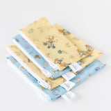 Bumkins Snack Bag 4 Pack: Mickey + Minnie Mouse Brunch Bunch lays neatly stacked on a white background.