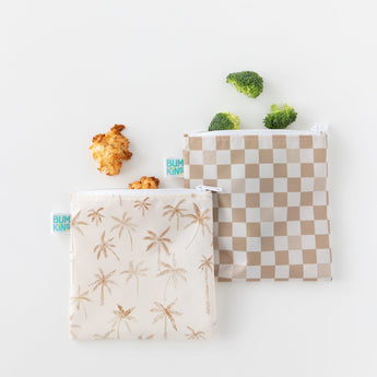Bumkins Reusable Snack Bag, Large 2 Pack: Palm Check holding broccoli and cookies on a white background.