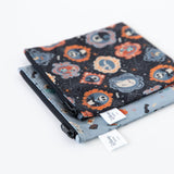 Bumkins Reusable Snack Bag, Large 2 Pack: Everyday Is Halloween lay stacked at an angle on a white background.