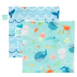 Bumkins Reusable Snack Bag, Large 2-Pack: Ocean Life & Whale Tail includes 2 blue waterproof zippered pouches with ocean-themed designs.