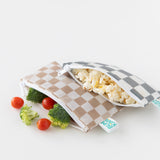 Bumkins Reusable Snack Bag, Small 2 Pack: Double Check holds snacks like popcorn and veggies on a white background.