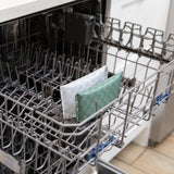 Roamio by Bumkins Reusable Snack Bag, Small 2 Pack: Rich & Boujee sits in the top rack of an open dishwasher.