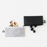Nuts and blackberries spill from Roamio by Bumkins Reusable Snack Bag, Small 2 Pack: Rich & Boujee on a white background.