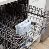Bumkins Reusable Snack Bag, Small 2 Pack: Coastal sits in the top rack of an open dishwasher.