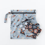 Bumkins Reusable Snack Bag, Small 2 Pack: Everyday Is Halloween lays on top of other bags with matching prints on a white background.