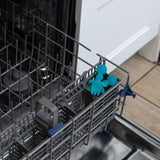 Bumkins Silicone Chewtensils®: Blue Jelly sit in the utensil compartment of an open dishwasher.