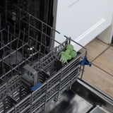 Bumkins Silicone Chewtensils®: Green Jelly sit in the utensil compartment of an open dishwasher.