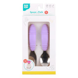 Bumkins Spoon + Fork: Lavender is shown in a white packaging box with a clear front window displaying the set of utensils.