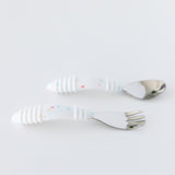 Bumkins Spoon + Fork: Vanilla Sprinkle lay horizontally on a white background.
