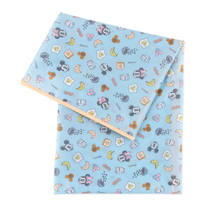 Bumkins Splat Mat: Mickey + Minnie Sunny Side Up, waterproof and stain-resistant, has a breakfast-themed print with Mickey and Minnie faces.