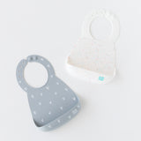 Bumkins Silicone Bib 2 Pack: Vanilla Sprinkle and Hearts rests on a white background.